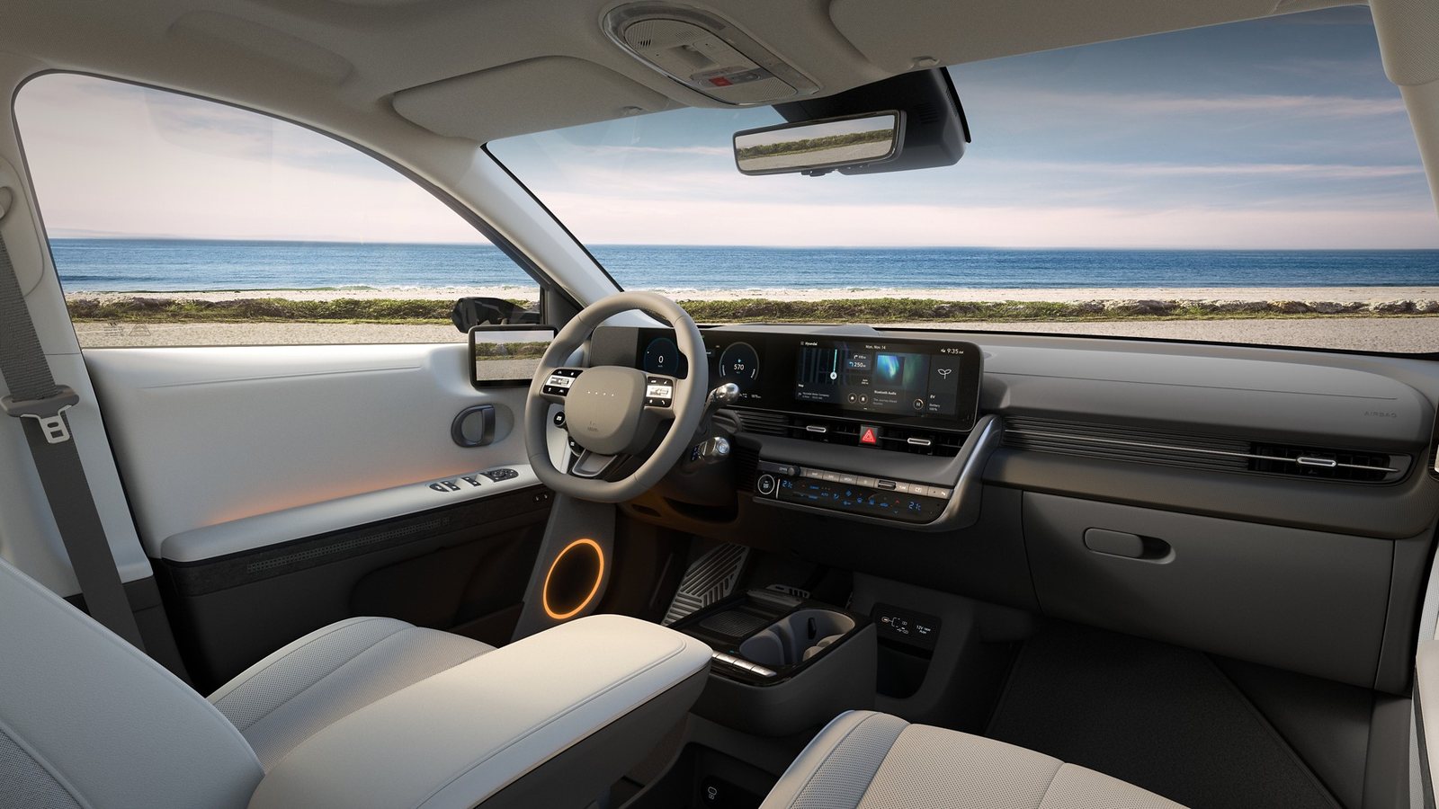Intérieur d'une Hyundai IONIQ 5 avec le poste de conduite et les écrans numériques allumés