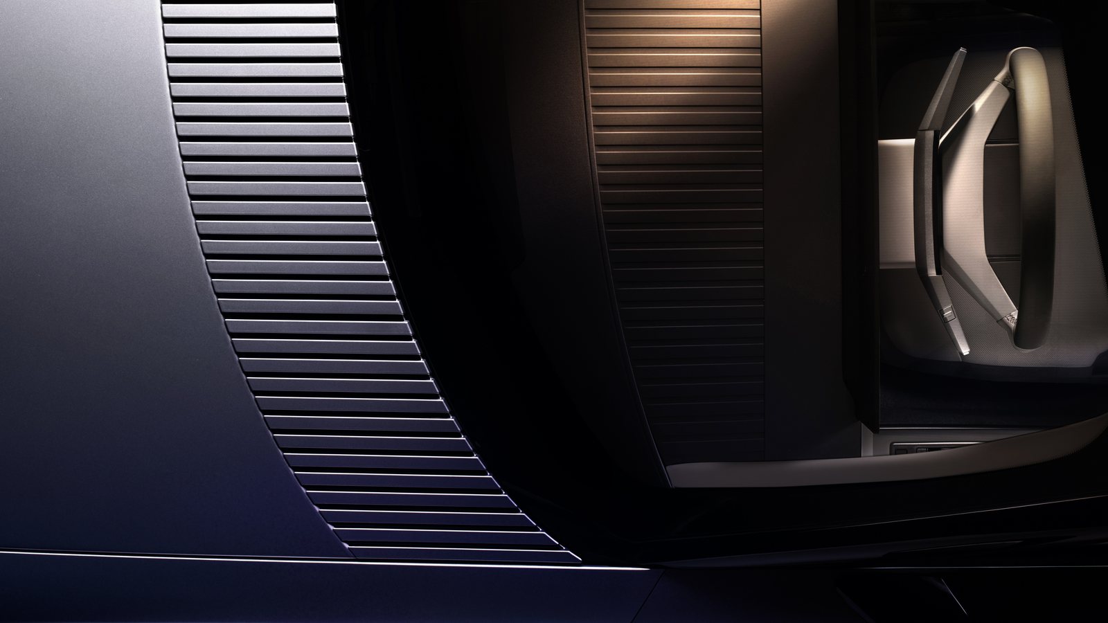 Détail des surfaces striées et de la garniture de porte de l'intérieur de la Jaguar Type 01